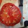 Cut halfway through, horizontally. Gotta love a meaty tomato!